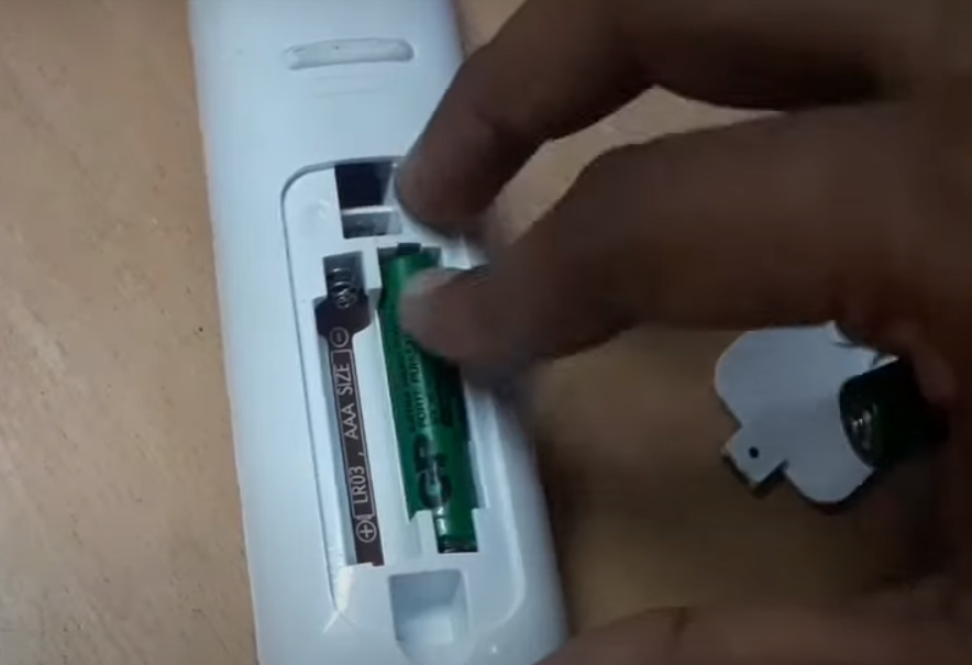 inserting cells or batteries into the remote